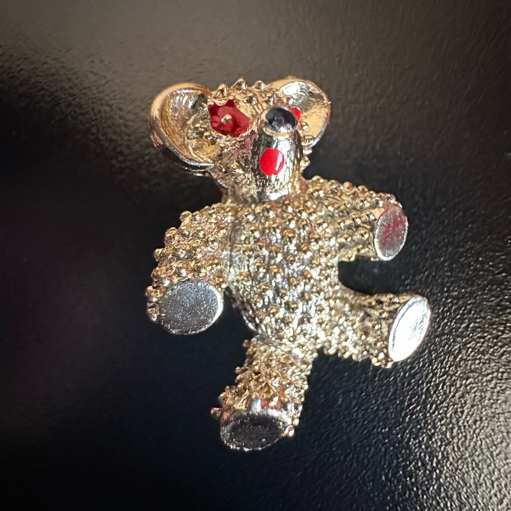 Vintage gold tone teddy bear with eyes brooch